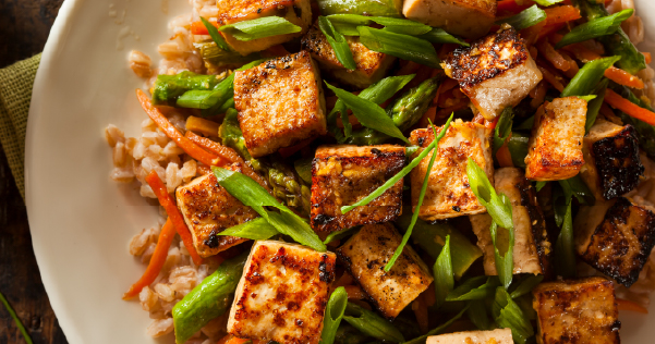 A tofu dish with veggies and brown rice